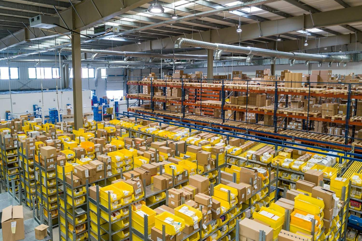 Rows of stocked shelving in a small distributor's warehouse
